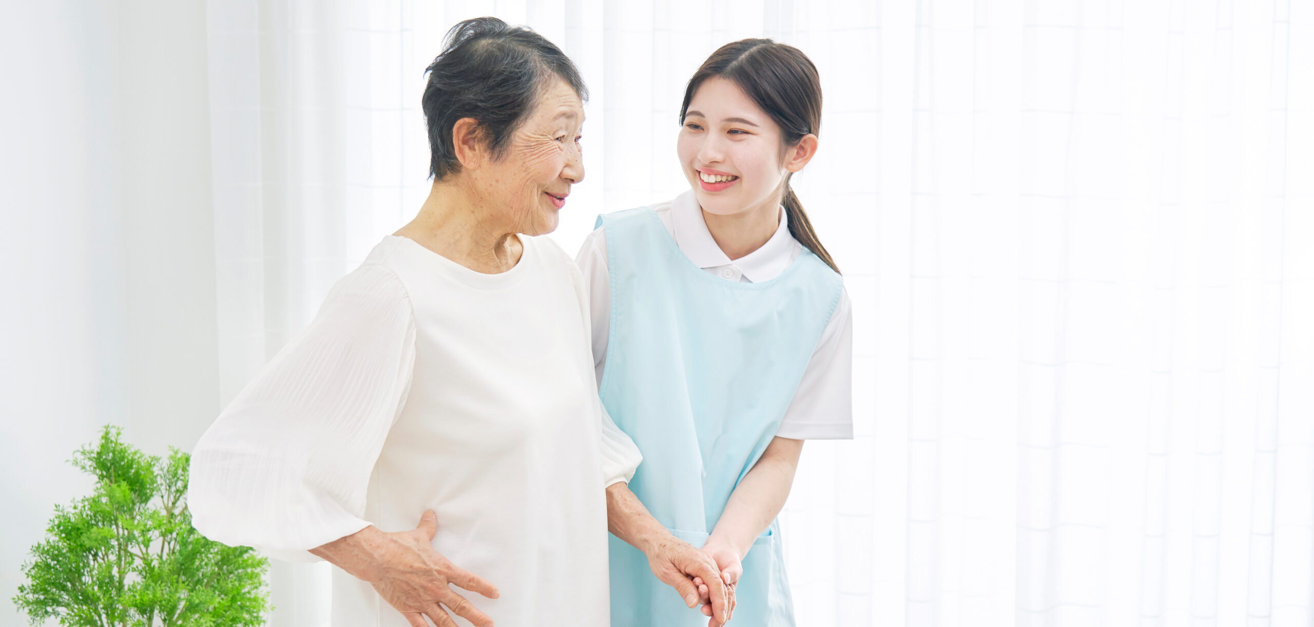 young female nurse assisting a pensioner